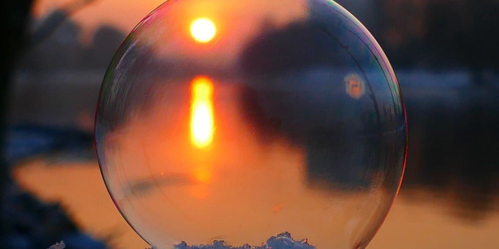 A captivating sunset captured through a transparent bubble