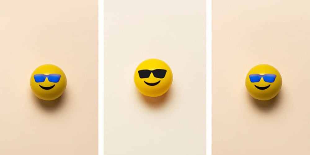 Three smiling emojis wearing glasses symbolize emotionally safe workplaces