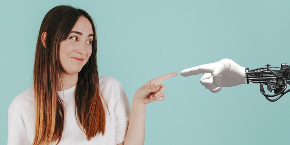 A female and robot pointing at each other